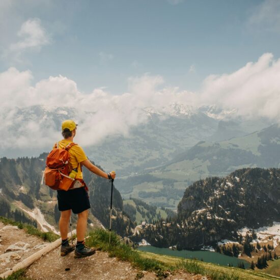 Hiker overlooking mountain valley—long-term function